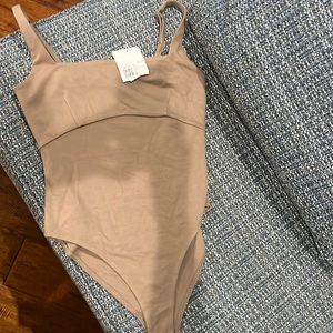 Tan body suit